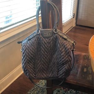 Coach gray purse with silver accents.